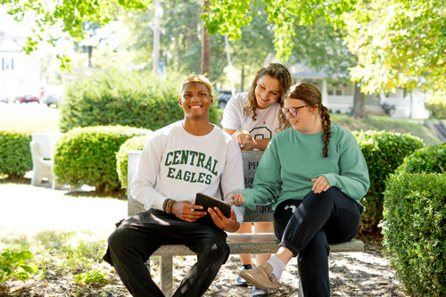 CMU students surrounding an iPad