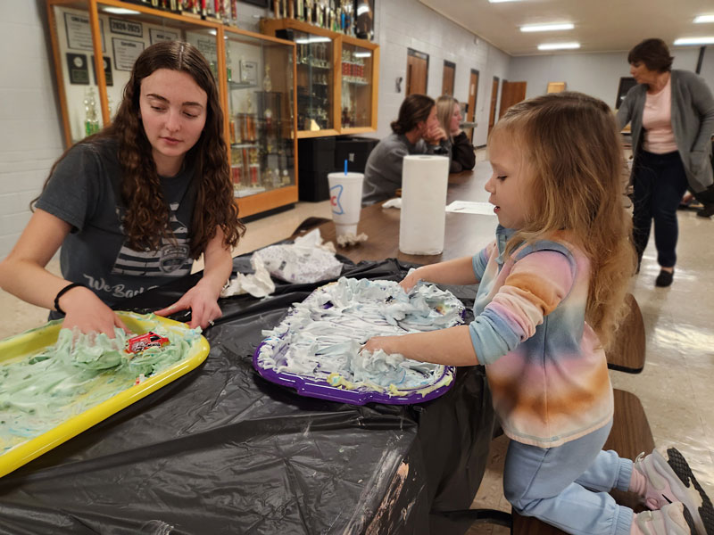 CMU education major student and child participating in educational play activity