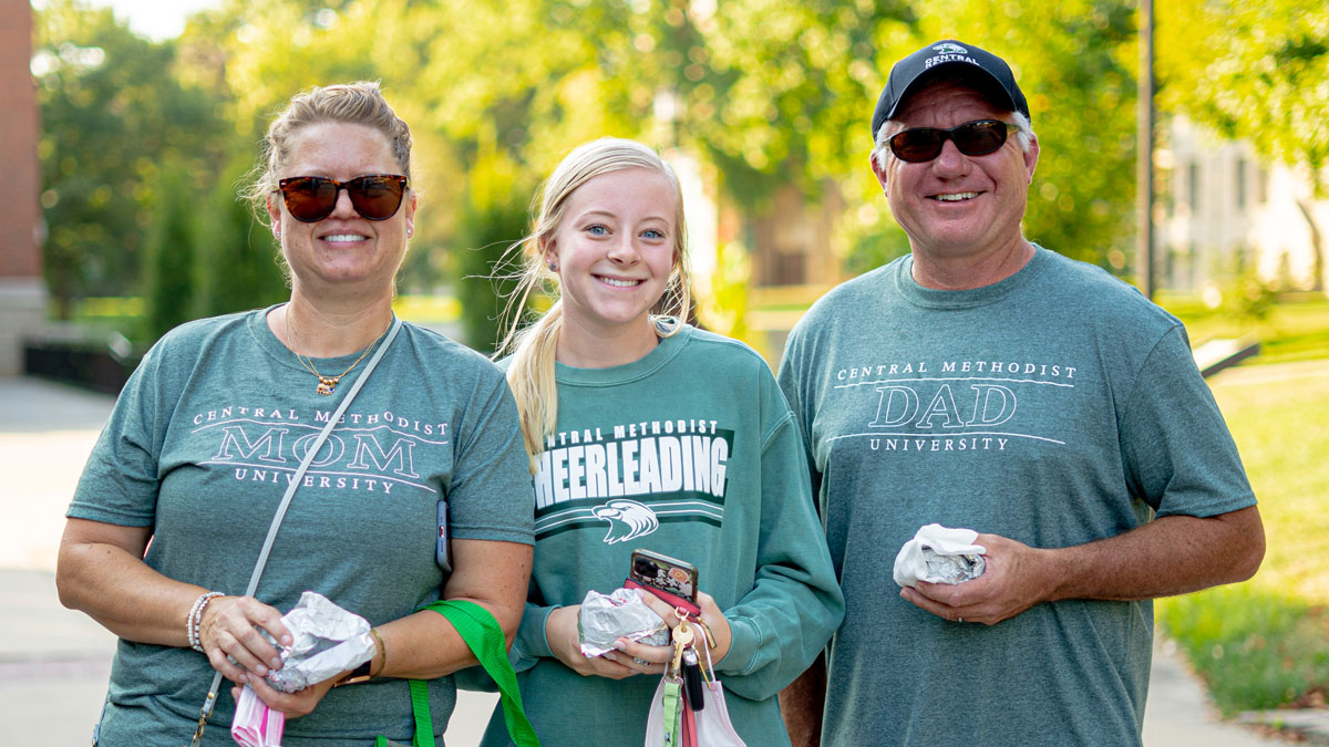 Student and parents on campus